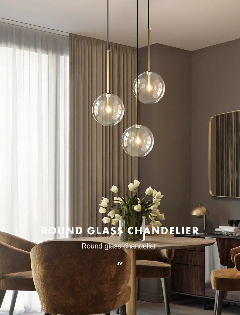 Modern LED pendant lamp with three round clear glass globes and gold suspension rods