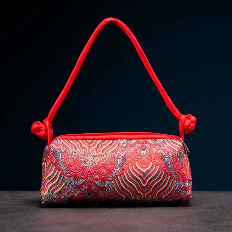 Simples Market women's shoulder bag, red embroidered silk handbag with decorative floral pattern.