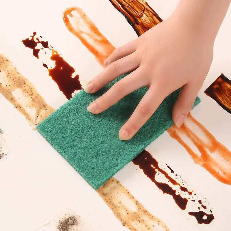 Simples Market green kitchen scrub pad for oil removal; reusable, scratch-free dishwashing pad.