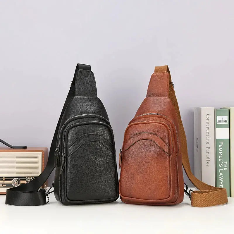 Leather chest bags (2) in black and brown, genuine top-grain leather with multiple zip pockets and adjustable straps.