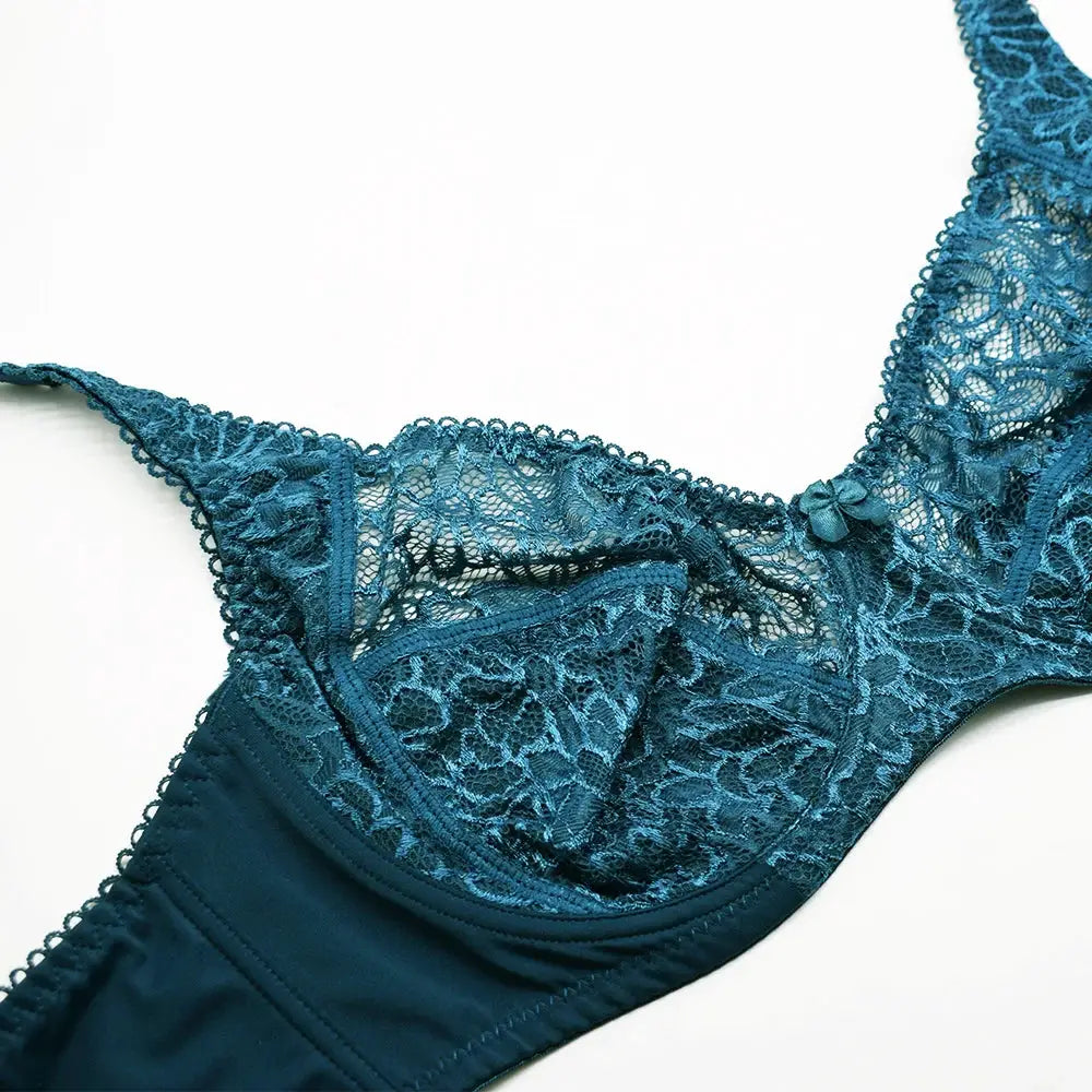 Bra in teal lace with floral pattern and small bow detail