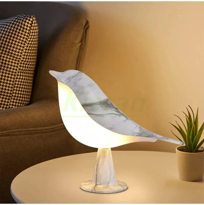 Simples Market Magpie LED desk lamp in marble white, bird-shaped table light with warm glow