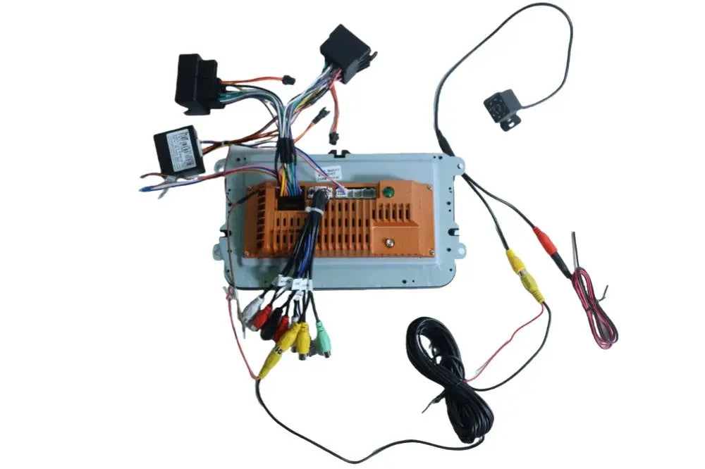 2-DIN Android car stereo with orange heatsink and wiring harness