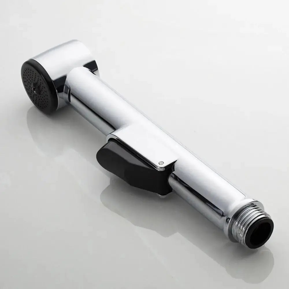 Handheld stainless steel bidet spray head by Simples Market; adjustable self-cleaning sprayer.