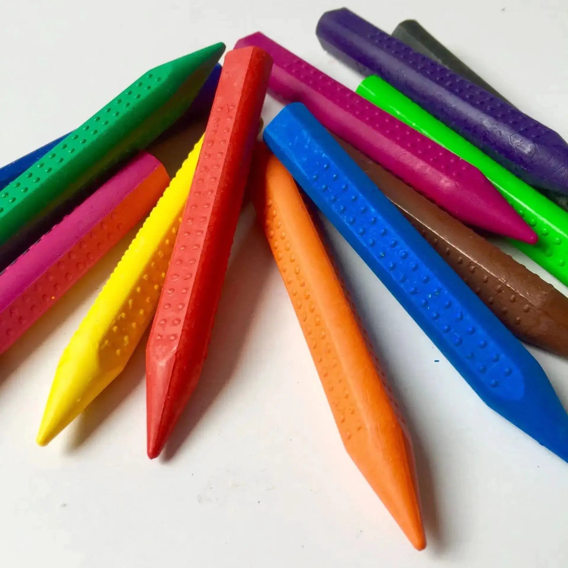 12-color wax crayon set; assorted bright sticks with dotted textured wrappers