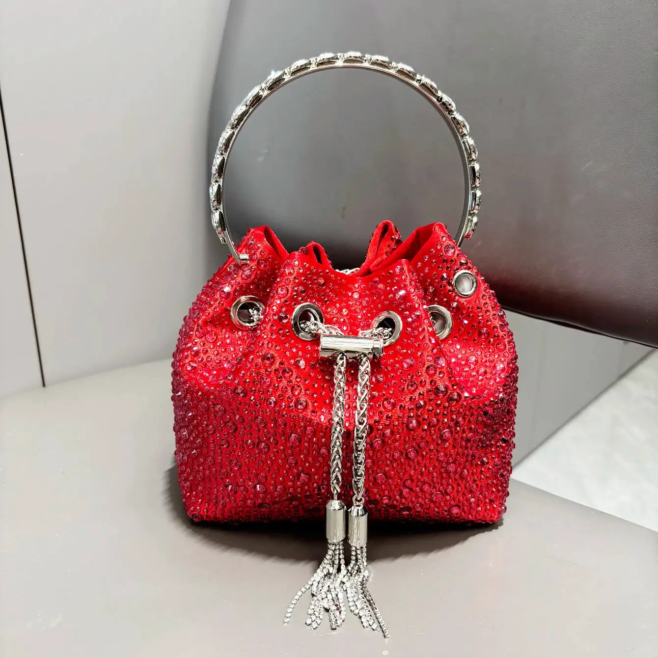 Red rhinestones evening clutch with silver ring handle and tassel