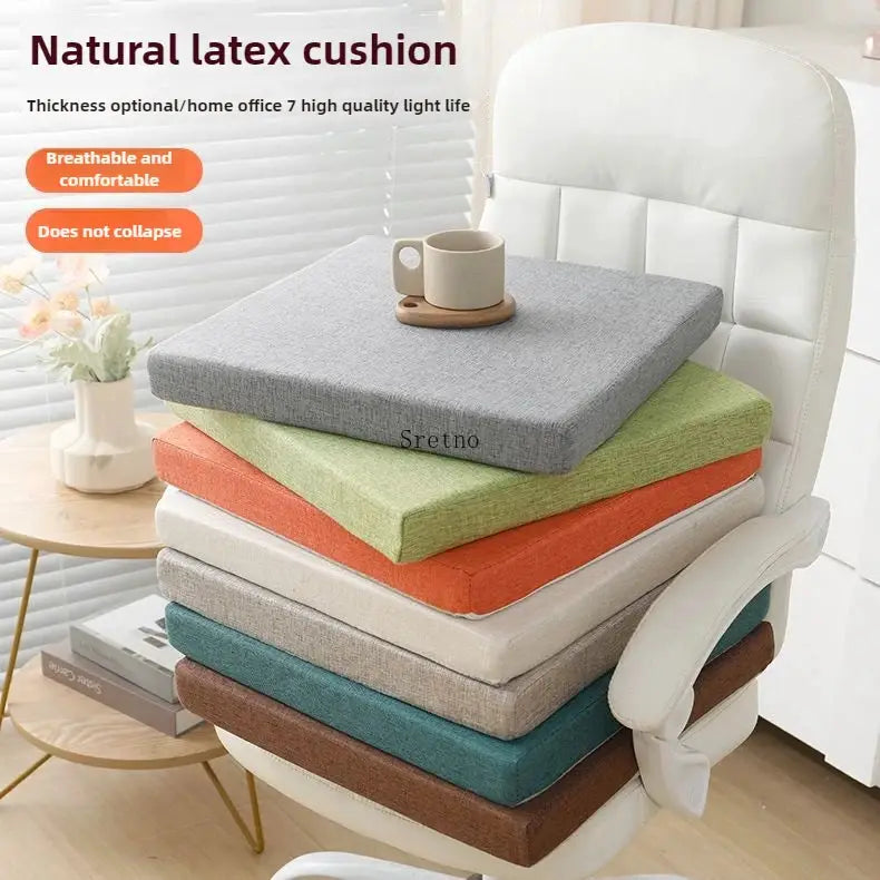 Natural latex cushion set, seven 50x50 cushions in assorted colors stacked on a white office chair.