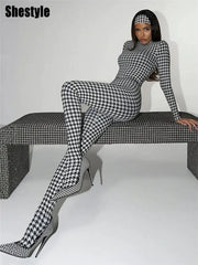Shestyle plaid bodycon jumpsuit with turtleneck in black-and-white, paired with matching high-heeled boots
