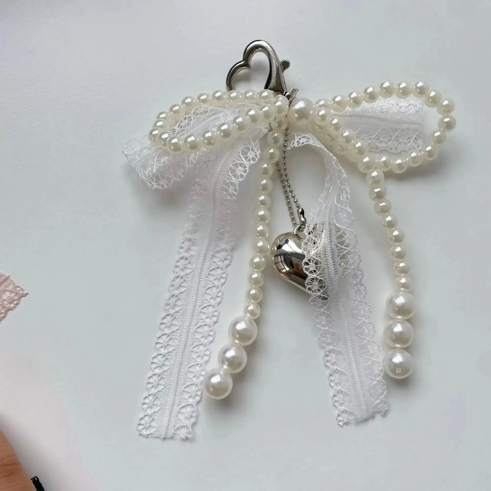 Y2K imitation pearl bead keychain with lace bowknot and silver heart charm
