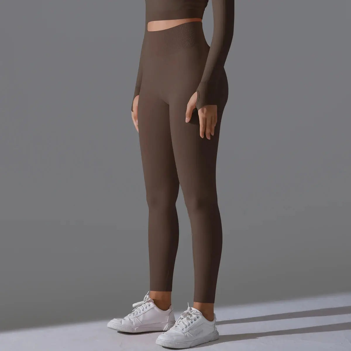 Women's seamless yoga leggings in brown with a high waist, tummy control, and scrunch butt lift.