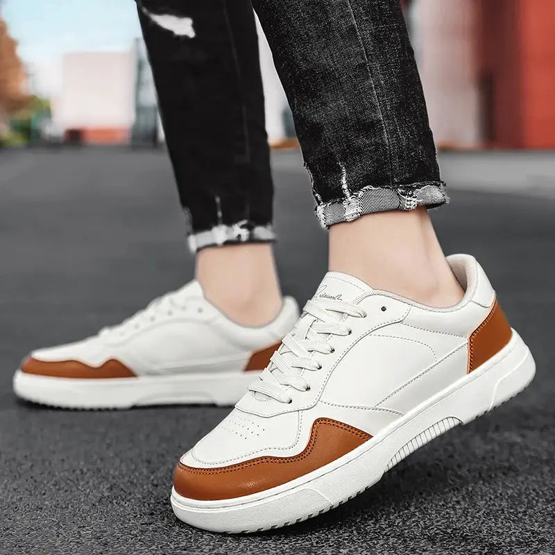Men's casual sneakers white with brown overlays, pair shown on asphalt