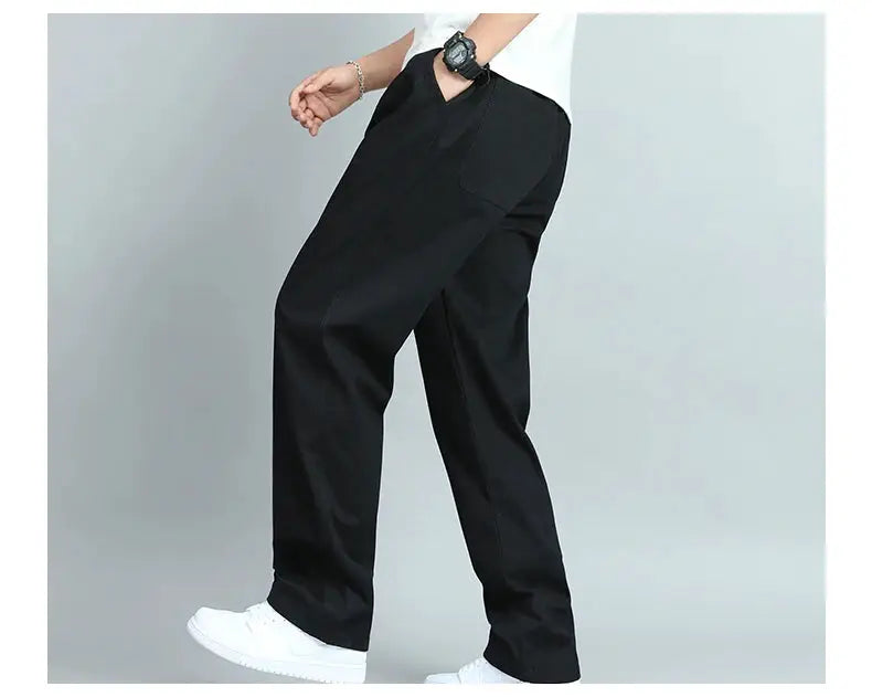 Big-size men's casual cotton trousers, black loose-fit straight pants with multiple pockets.