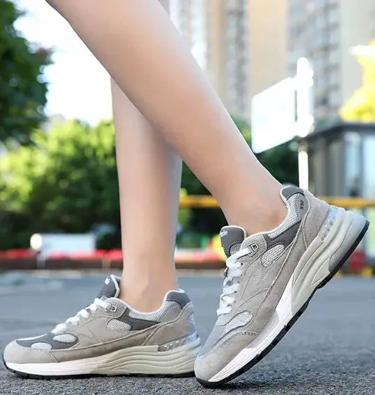 Pair of Simples Market mesh running shoes, retro grey sneakers with breathable mesh and anti-slip sole.