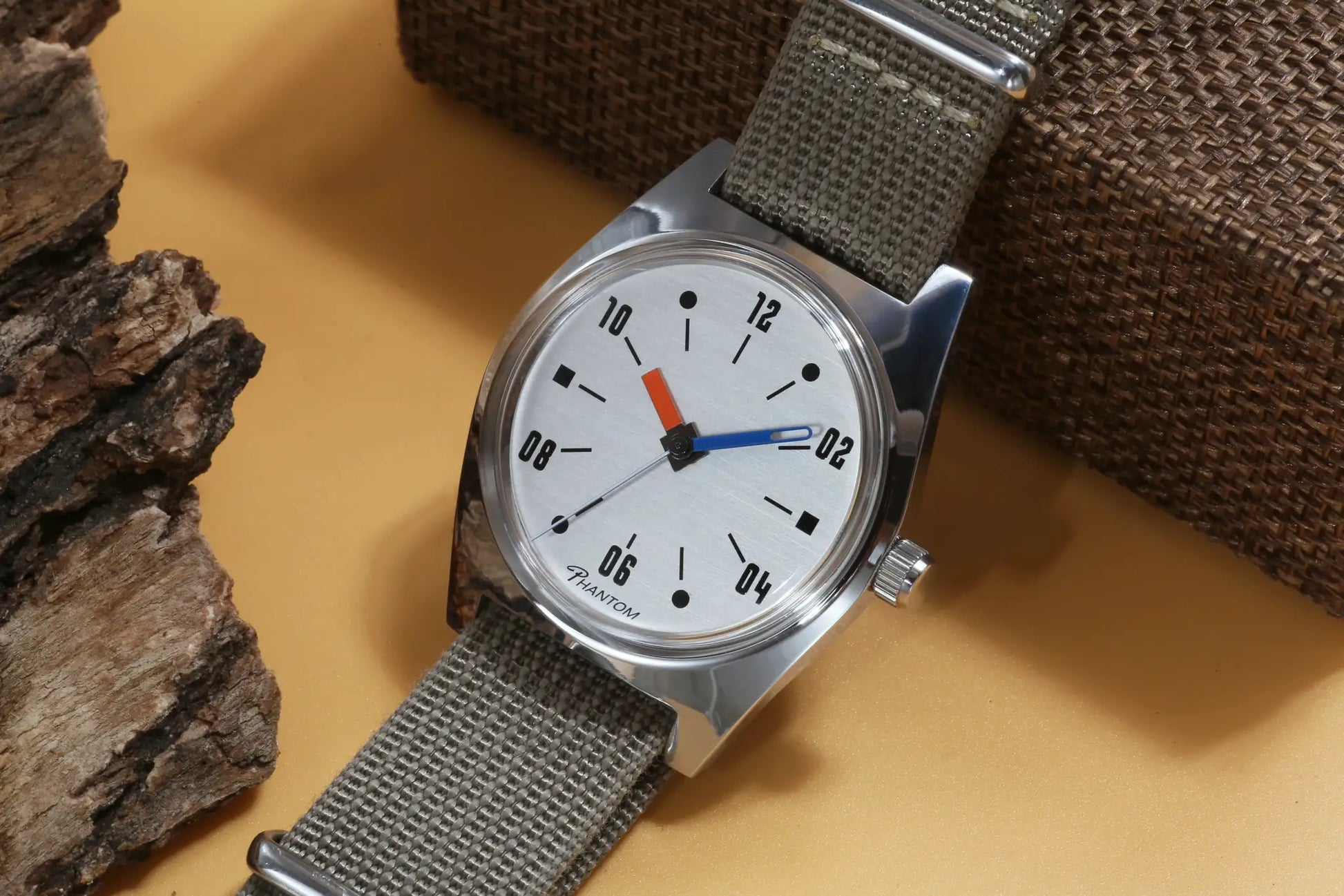 Simples Market 7120 hand-wind mechanical men's 36mm watch with silver dial, stainless case, and gray fabric strap.