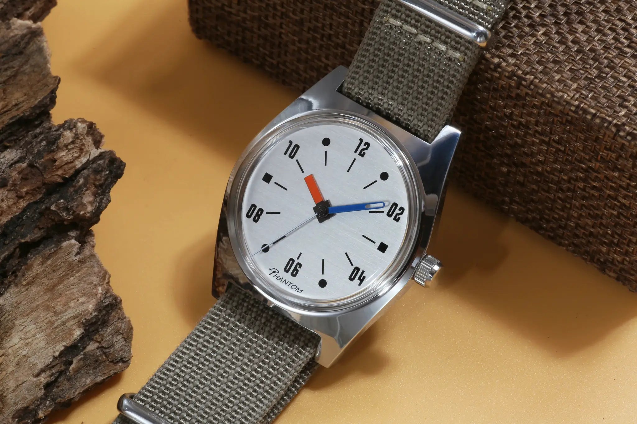 Simples Market 7120 hand-wind mechanical men's 36mm watch with silver dial, stainless case, and gray fabric strap.