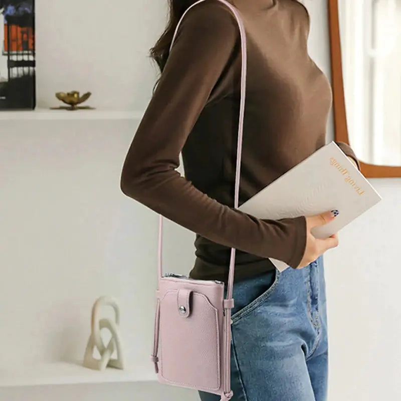 PU leather diagonal crossbody bag in pink with buckle and compact size.