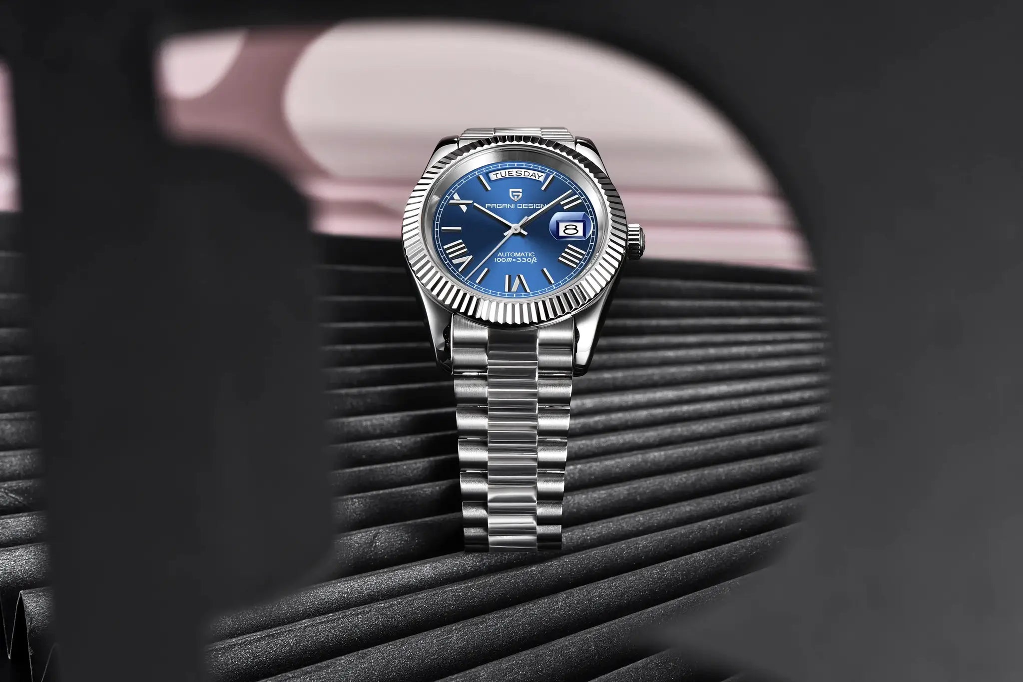 Pagani Design men's automatic stainless steel watch with blue dial, day-date window, silver fluted bezel
