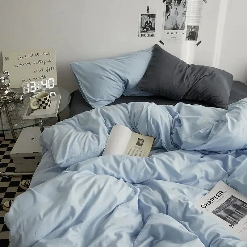 Cotton bedding 4-piece solid-color set in light blue for dorm rooms on a bed