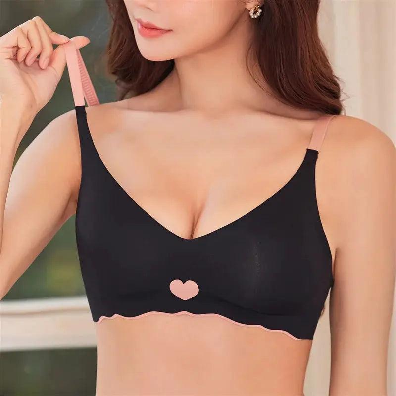 Sexy push-up bra in black with pink heart motif, pink straps and scalloped pink hem, wireless seamless