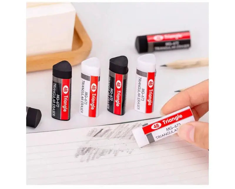 Six 4B triangle erasers by Simples Market in black, white and red, novelty school supplies