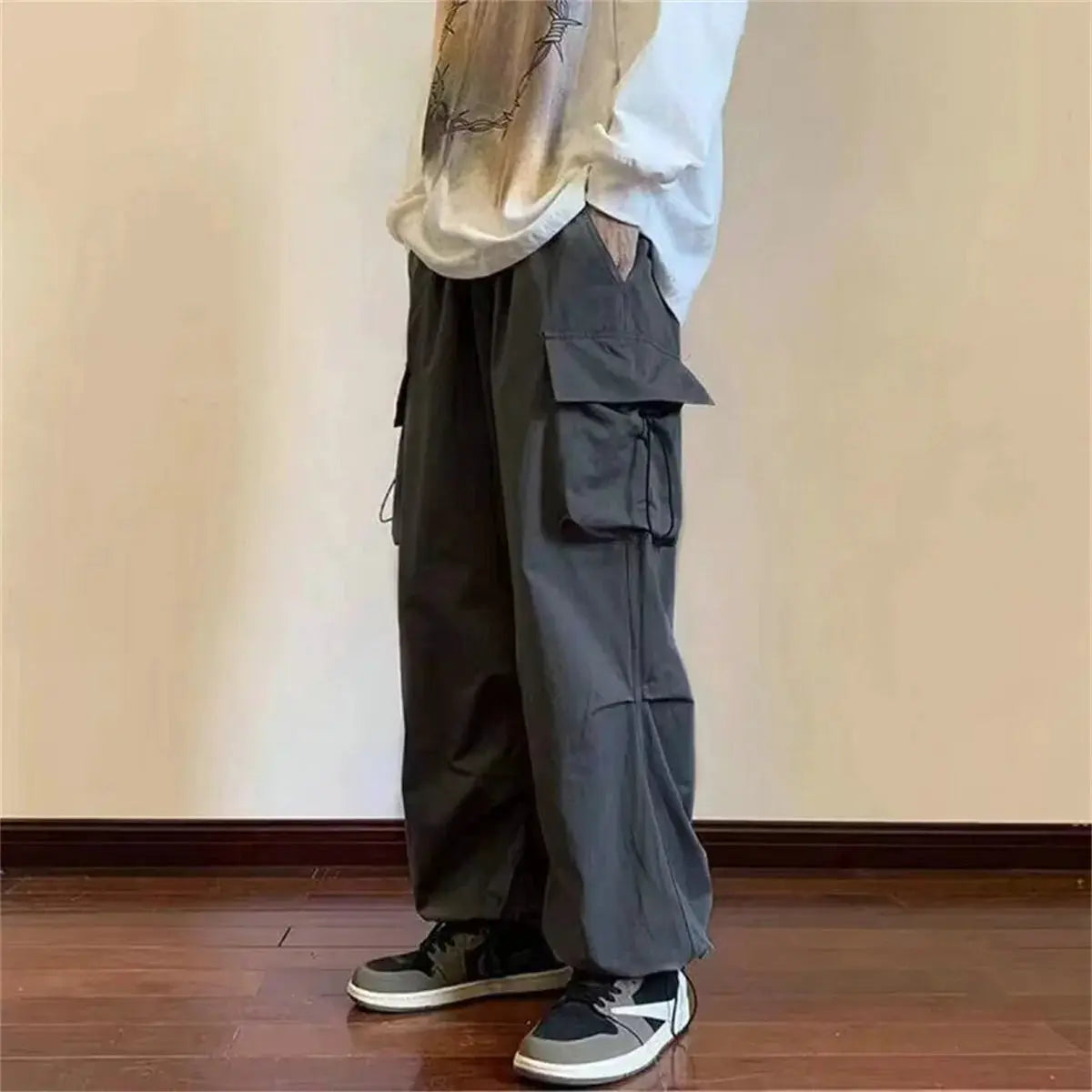 Men's cargo pants with elastic waist, multiple pockets, loose baggy harem-fit in dark gray