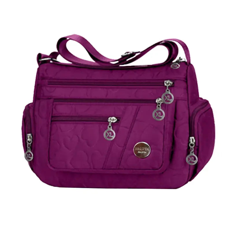 Crossbody shoulder bag purple nylon by Simples Market with multiple zip compartments