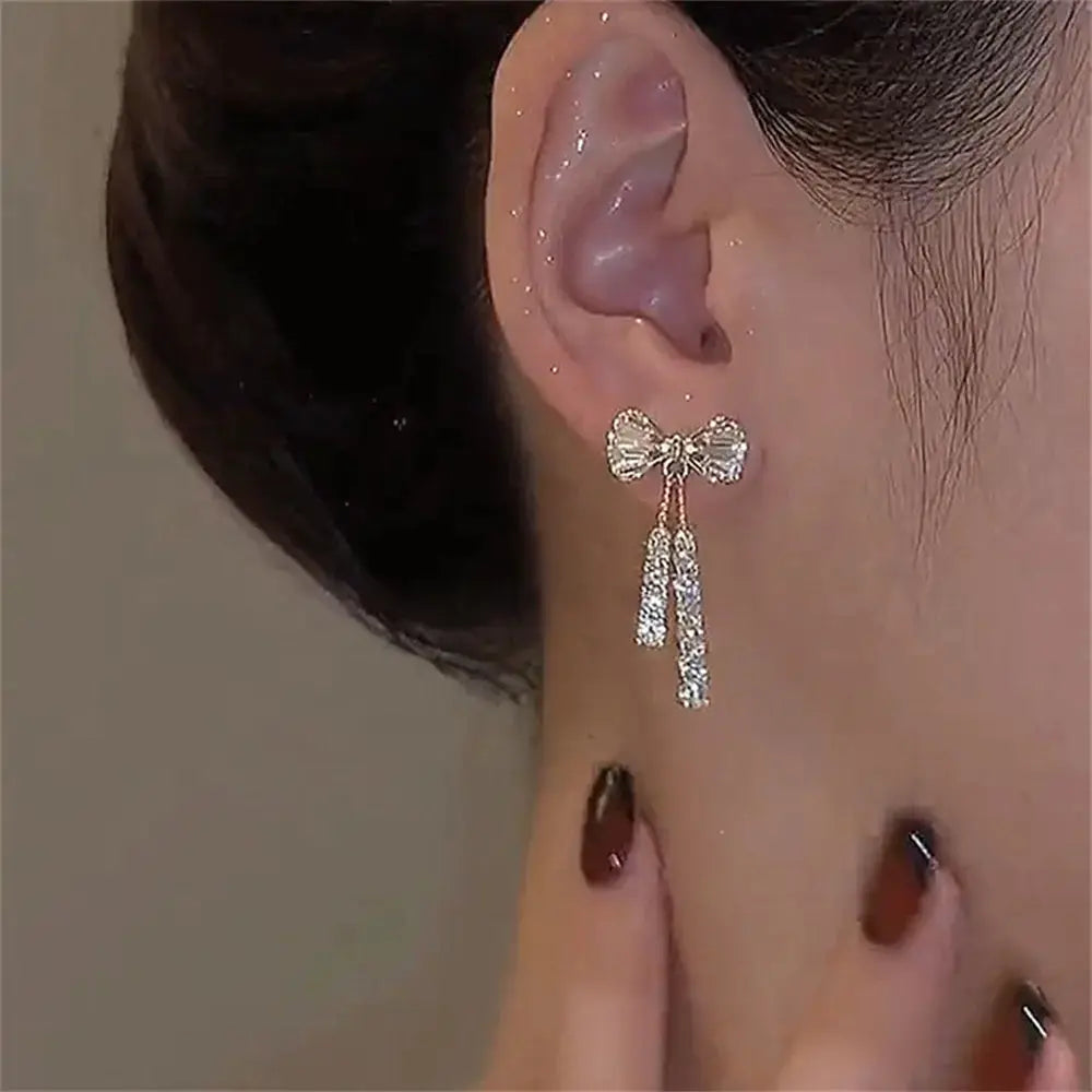 Fashion bow crystal zircon earrings for women with dangling crystal bars in gold-tone