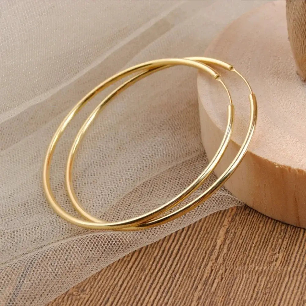 Stainless steel circle hoop earrings, gold-tone, pair of minimalist large hoops