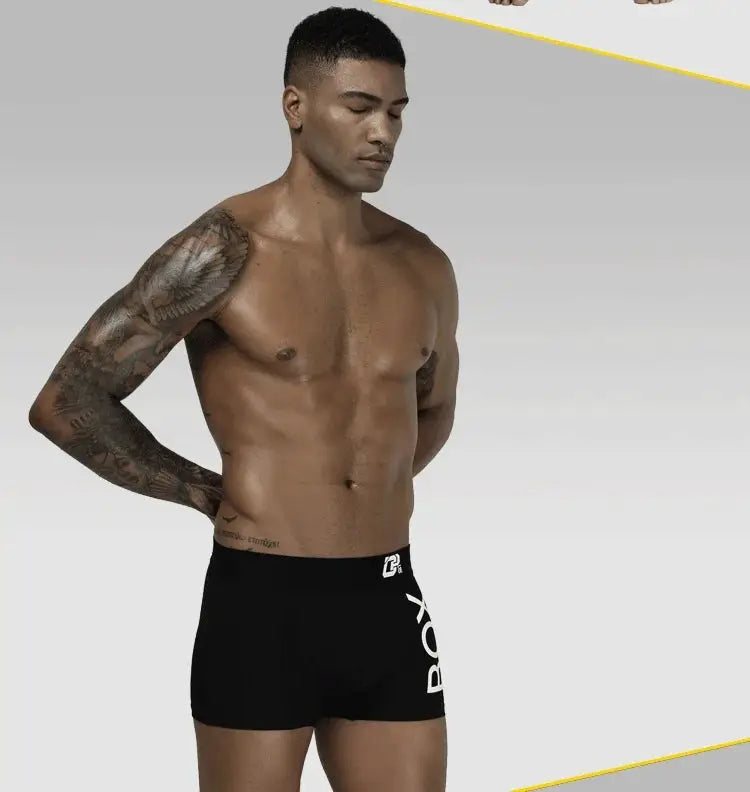 Men's black cotton boxer briefs with U-pouch for breathable comfort.