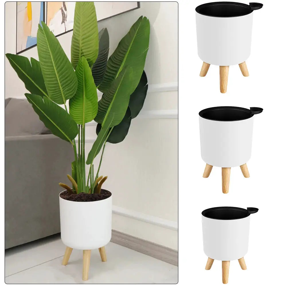 Floor-standing white round plant pot with three wooden legs, self-watering drainage, for herbs/bonsai; Simples Market.