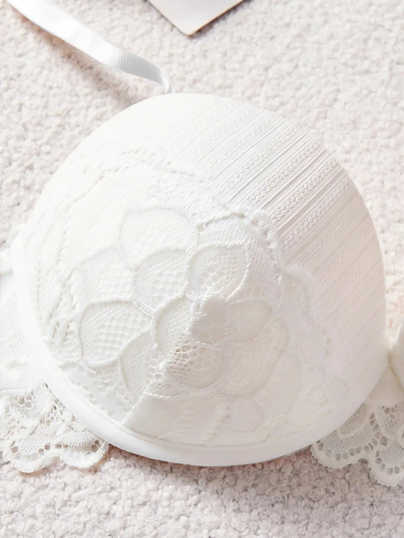 White lace bra by Simples Market with floral pattern and satin strap