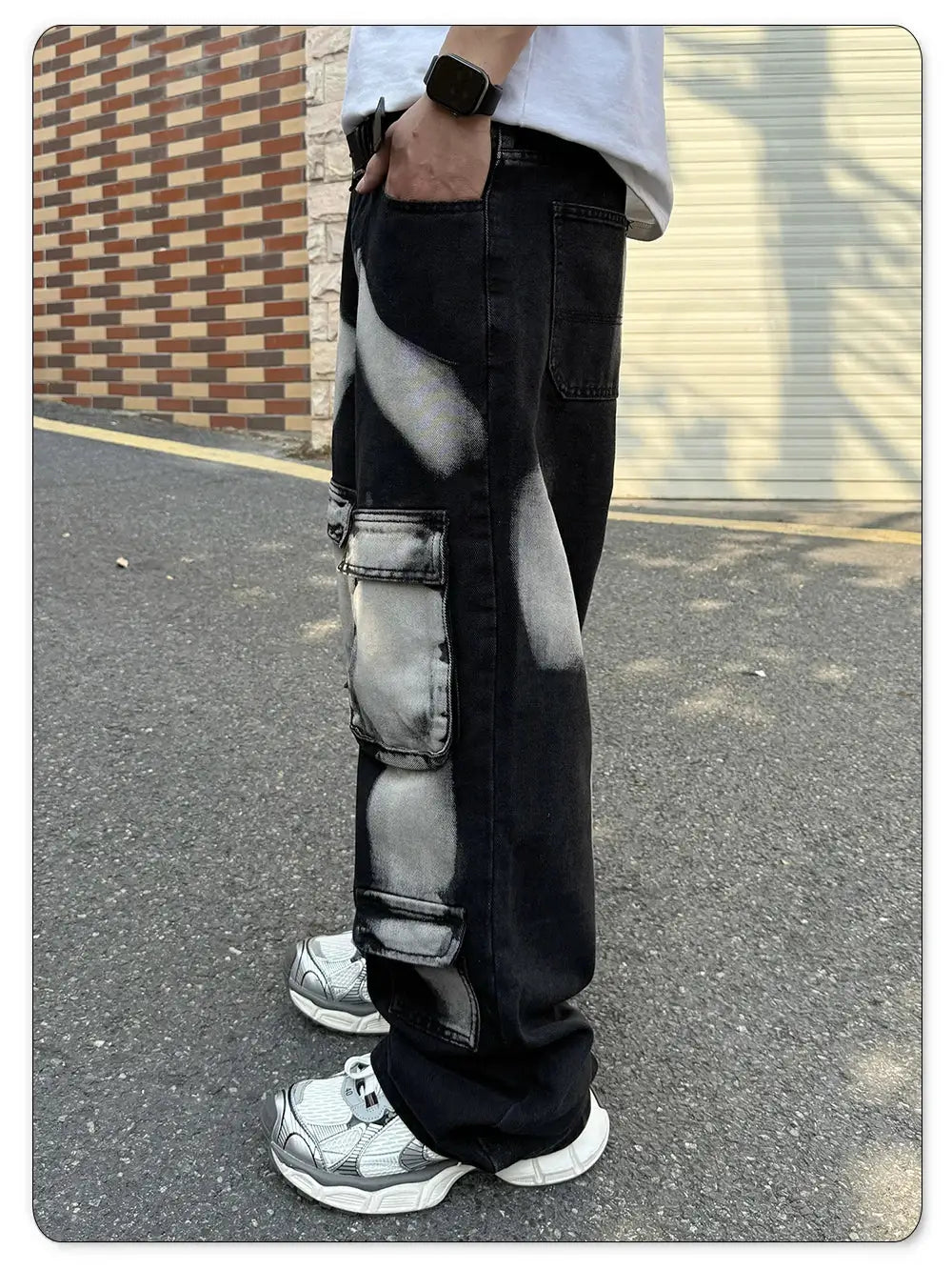 Men's black straight-leg workwear denim jeans with multiple cargo pockets and ink splashes