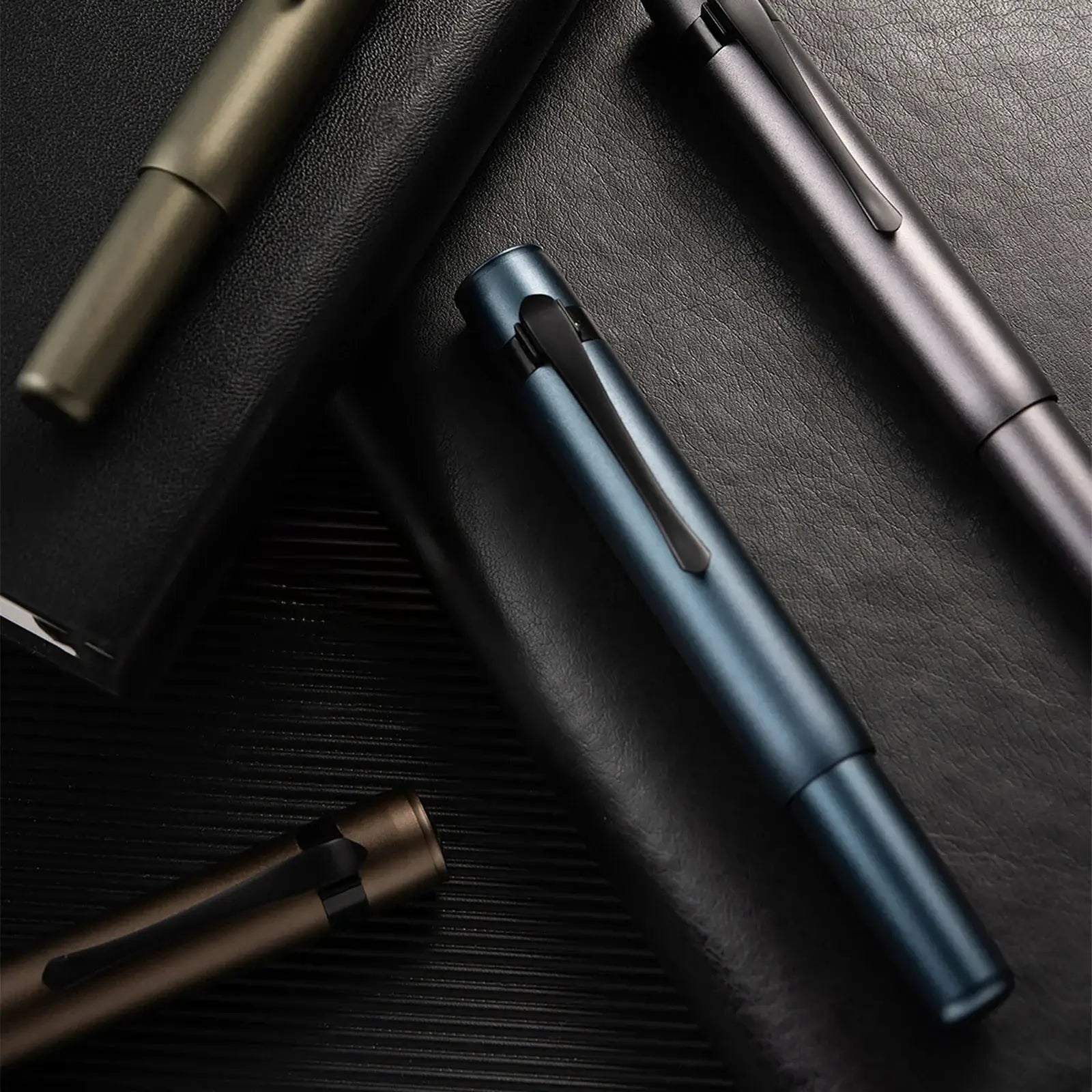 Hongdian M2 mini fountain pen set by Simples Market in Black Forest tones; blue, bronze and gray pens.