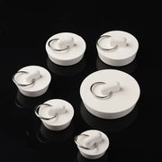 White rubber sink plugs with metal rings by Simples Market, assorted sizes