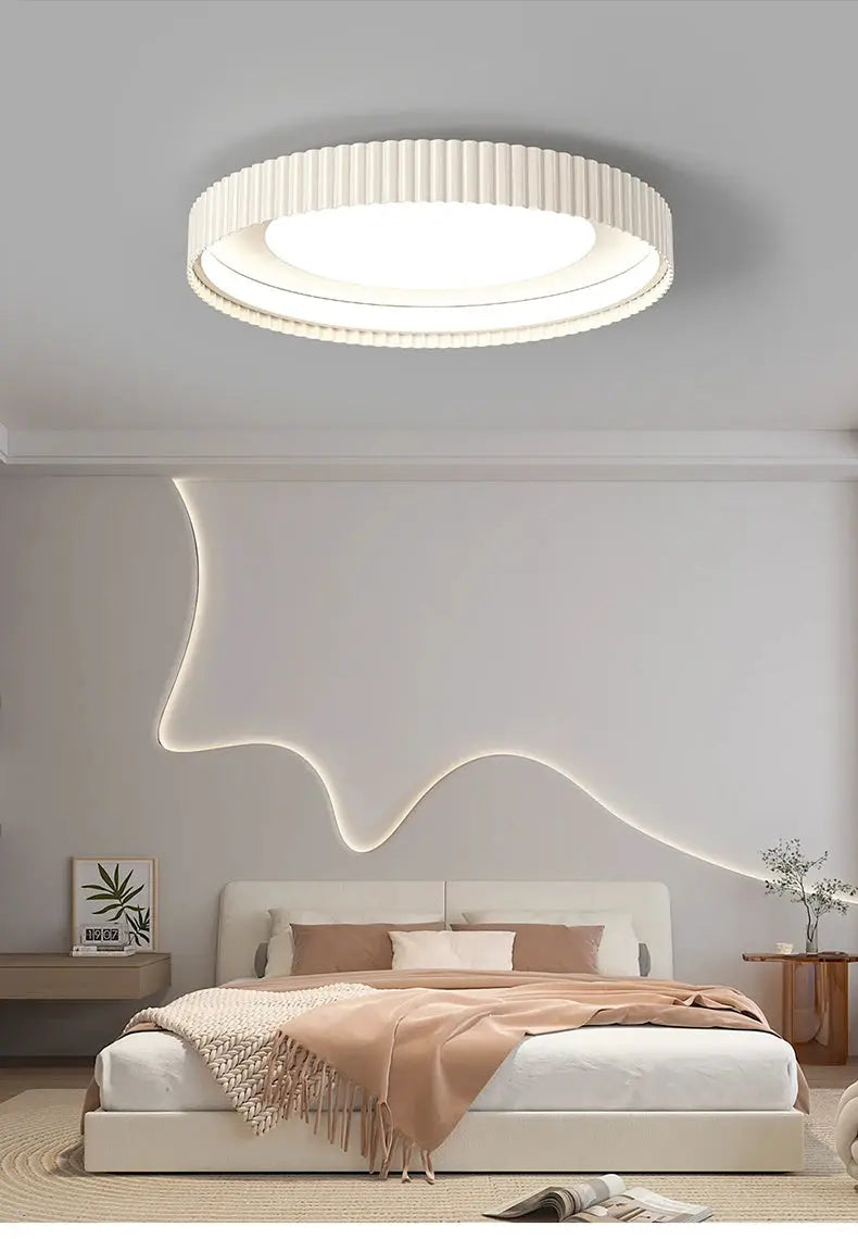 Modern round LED ceiling light by Simples Market with ribbed white ring for bedroom decor