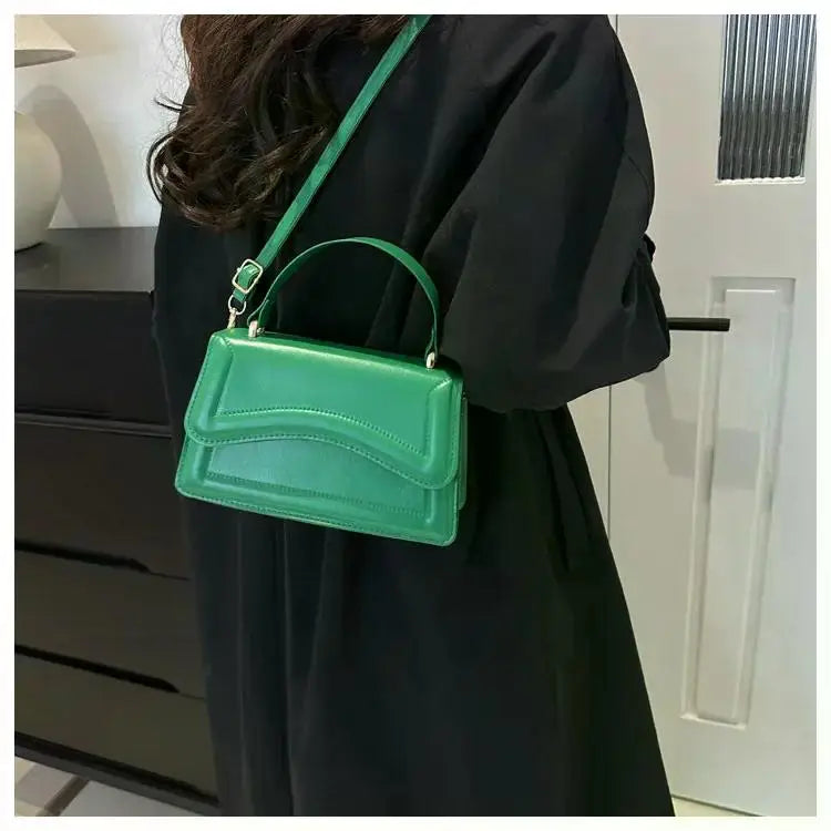 Simples Market green PU leather handbag with top handle and crossbody strap