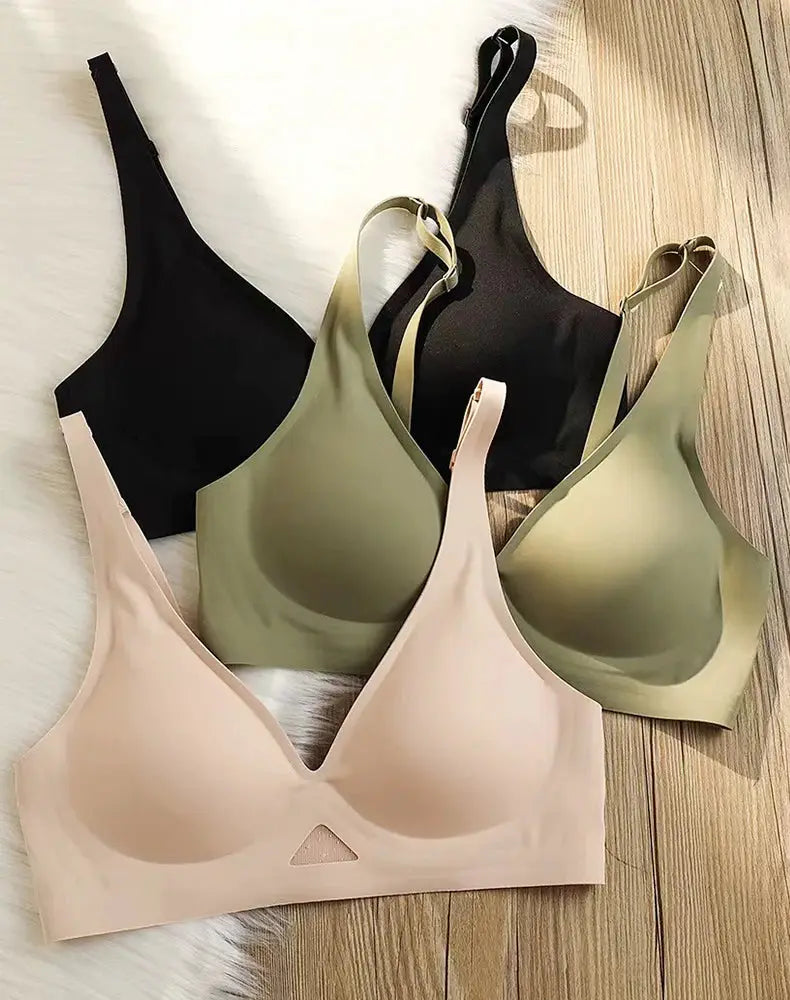 Wire-free bra set of four seamless bras in black, beige, olive green, and nude.