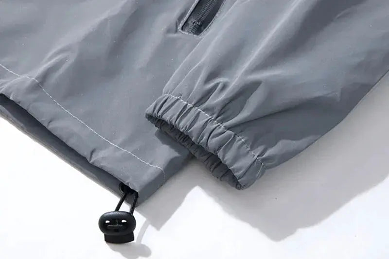Jacket gray polyester with elastic cuffs and a drawstring hem