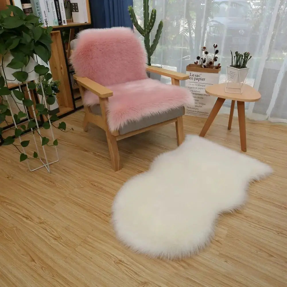 Artificial sheepskin long-hair rug set: pink fluffy chair cover and white shaggy floor mat on wooden floor