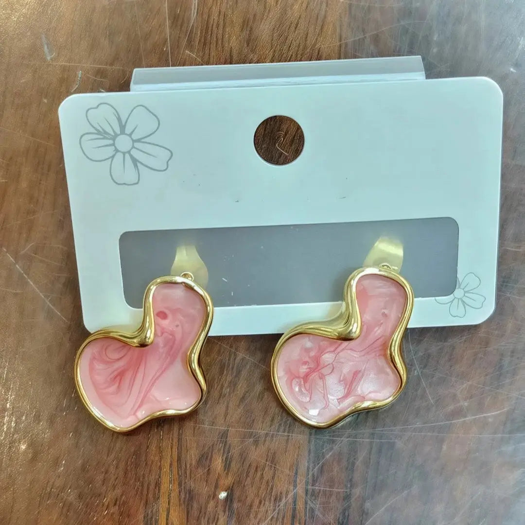 Pink marbled irregular stud earrings with a gold-tone frame, pair