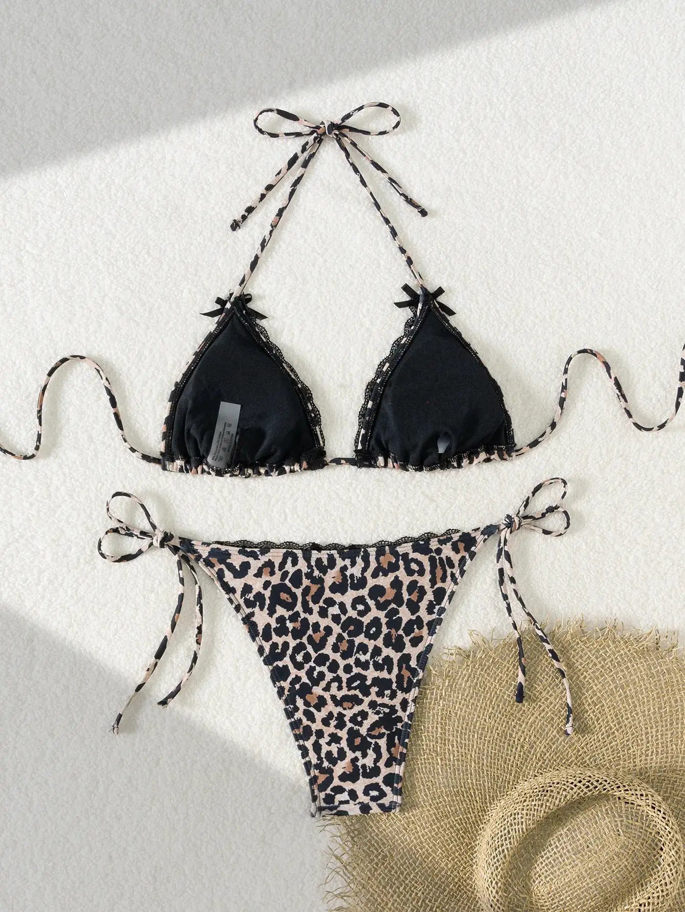 Simples Market two-piece bikini set: black triangle top with leopard-print straps and leopard Brazilian-cut bottoms