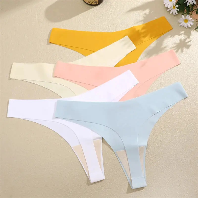 Five-piece set of ice silk seamless V-waist low-rise thong underwear in yellow, cream, pink, white and light blue.
