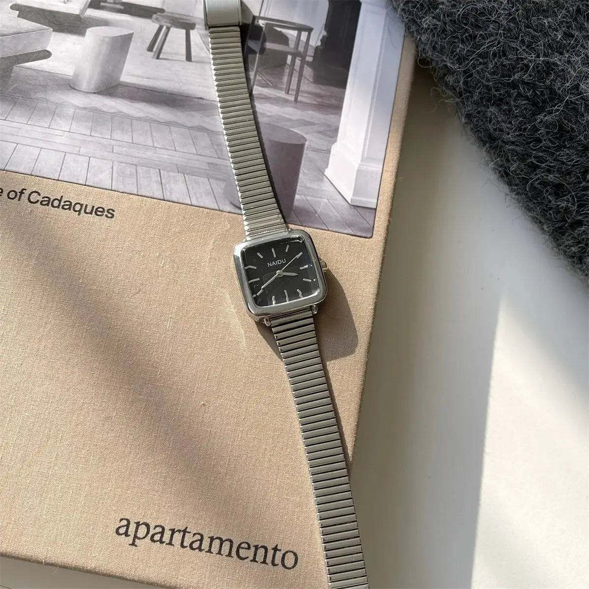 Women's NAIDU quartz watch with square black dial and stainless steel bracelet