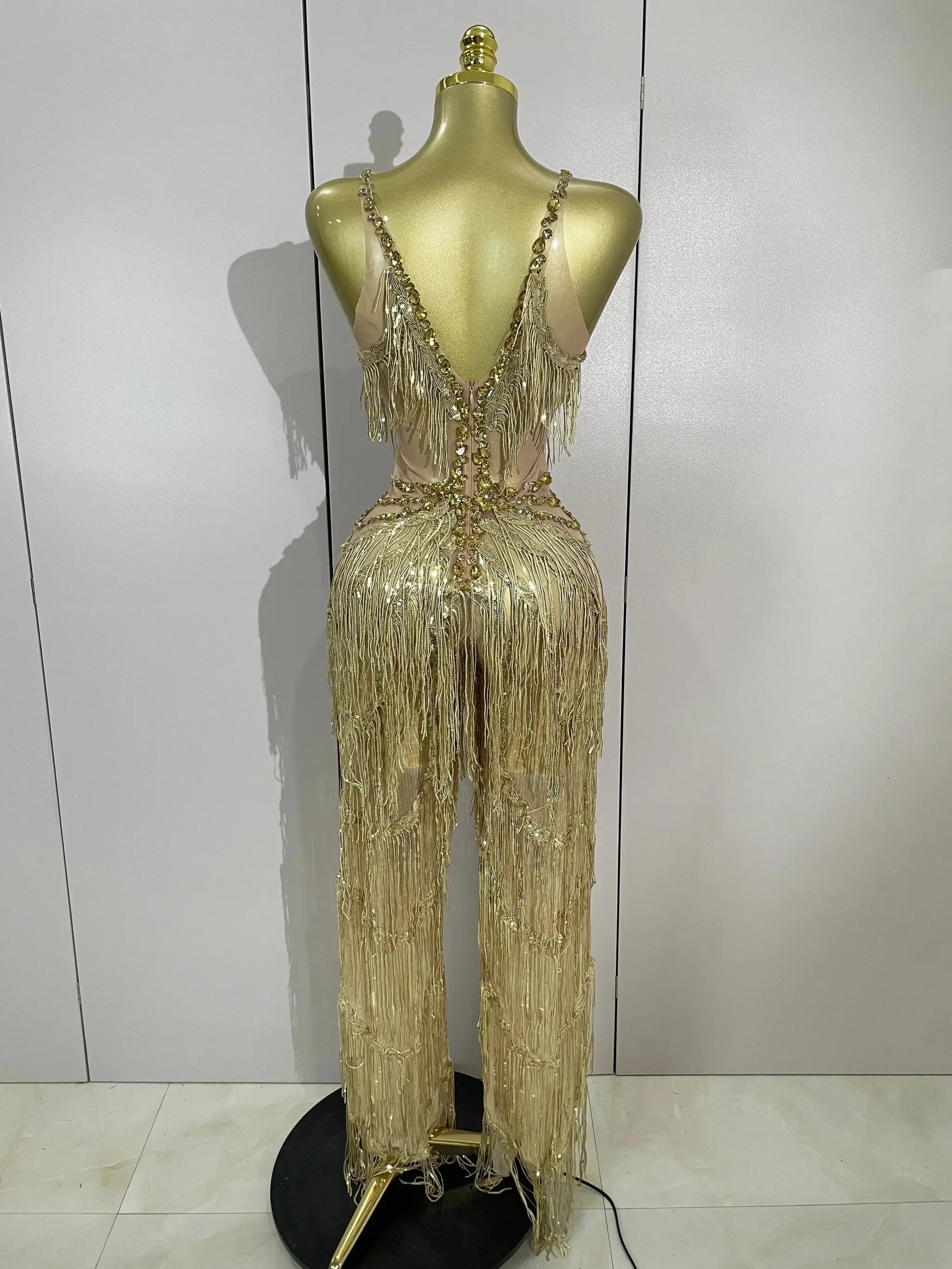 Gold-tone rhinestone sequined fringe jumpsuit for women on mannequin