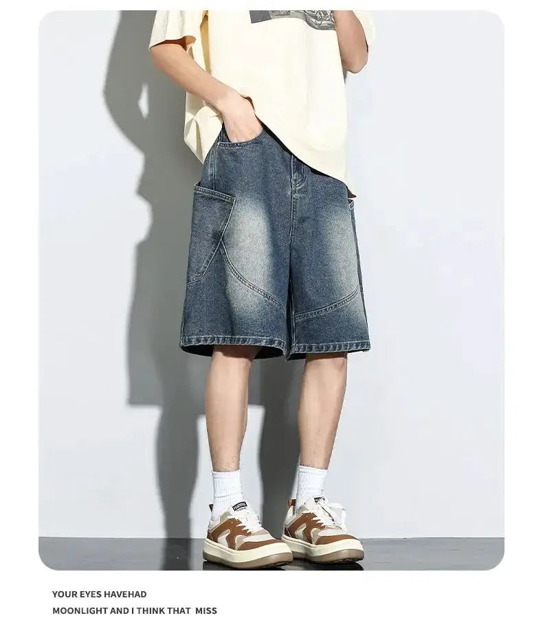 Baggy denim shorts in light vintage wash with patch pockets, knee-length