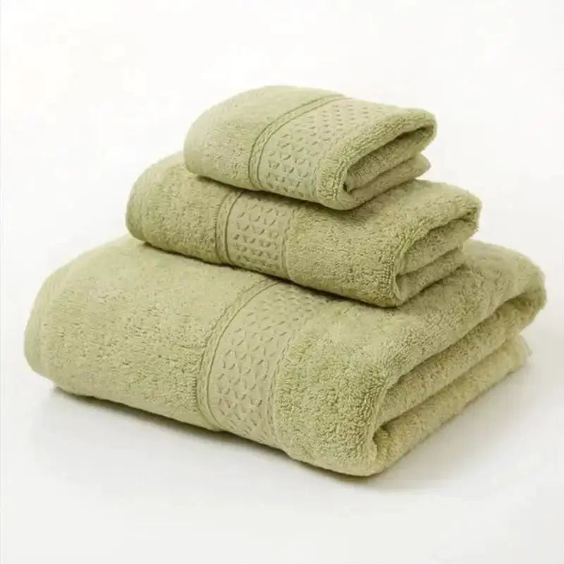 Towel set: three beige cotton towels (bath, hand, washcloth); ultra-soft and highly absorbent