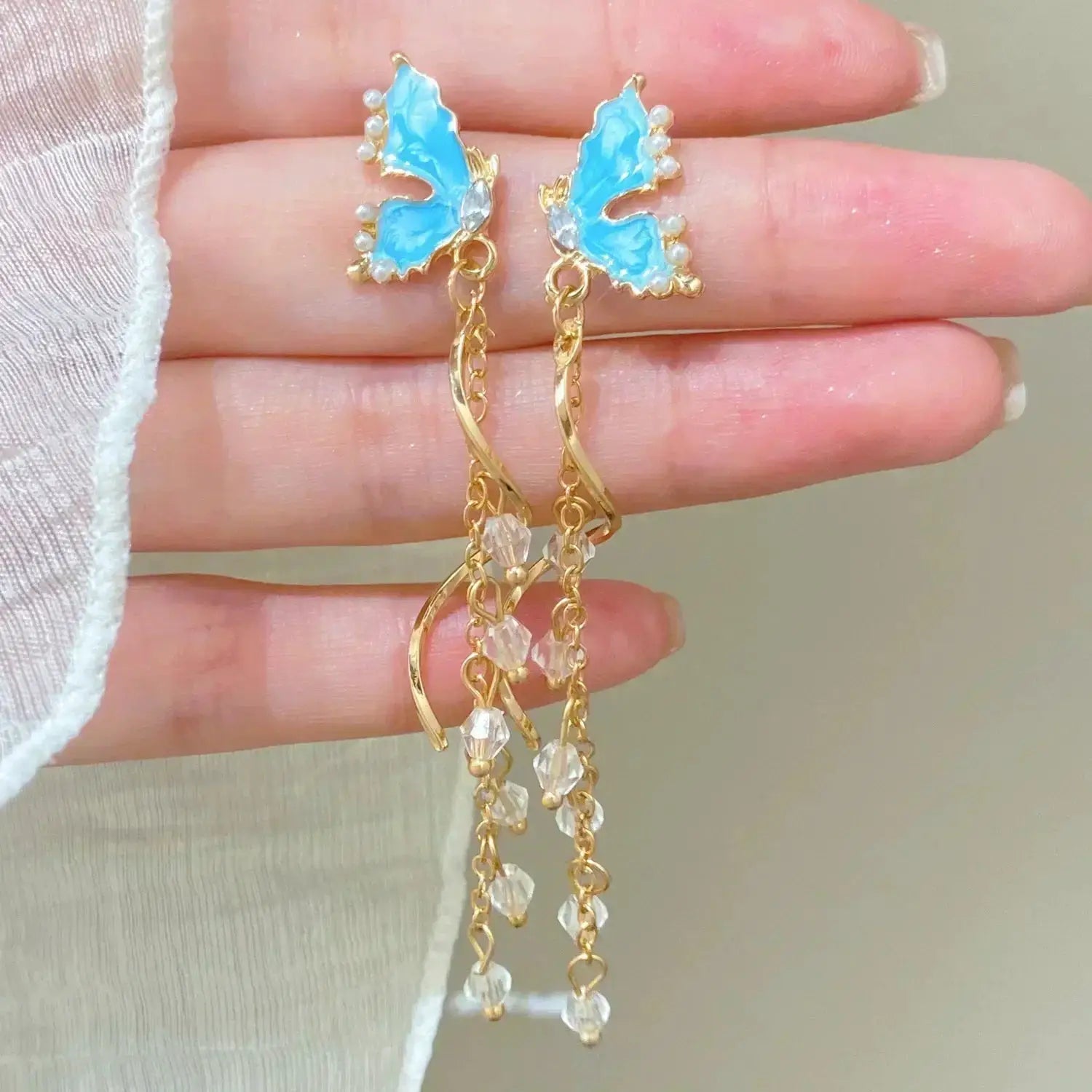 Simples Market Exaggeration Ocean shell texture stud earrings in blue enamel with gold chains and crystal beads