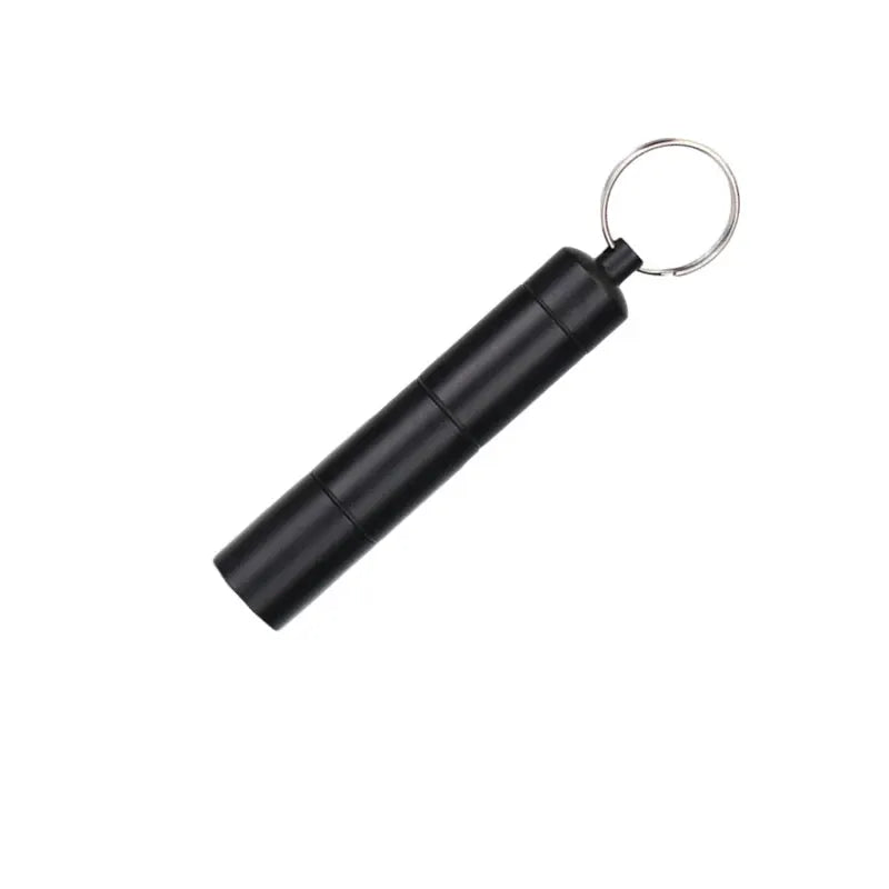 Mini portable aluminum waterproof pill box with three-compartment design and key ring, black.