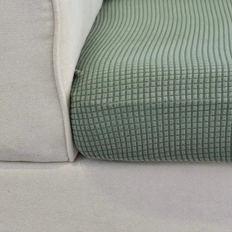 Elastic green sofa cover with ribbed grid texture for living room furniture by Simples Market