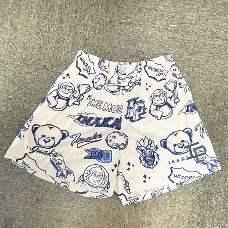 Men's breathable mesh shorts in white with blue graphic prints, elastic waistband, quick-dry beach style
